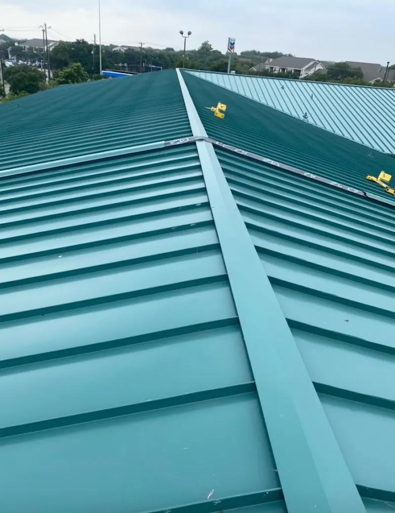 Green commercial metal roof ridge and valley for Metal Roof Repair in Kingsbury